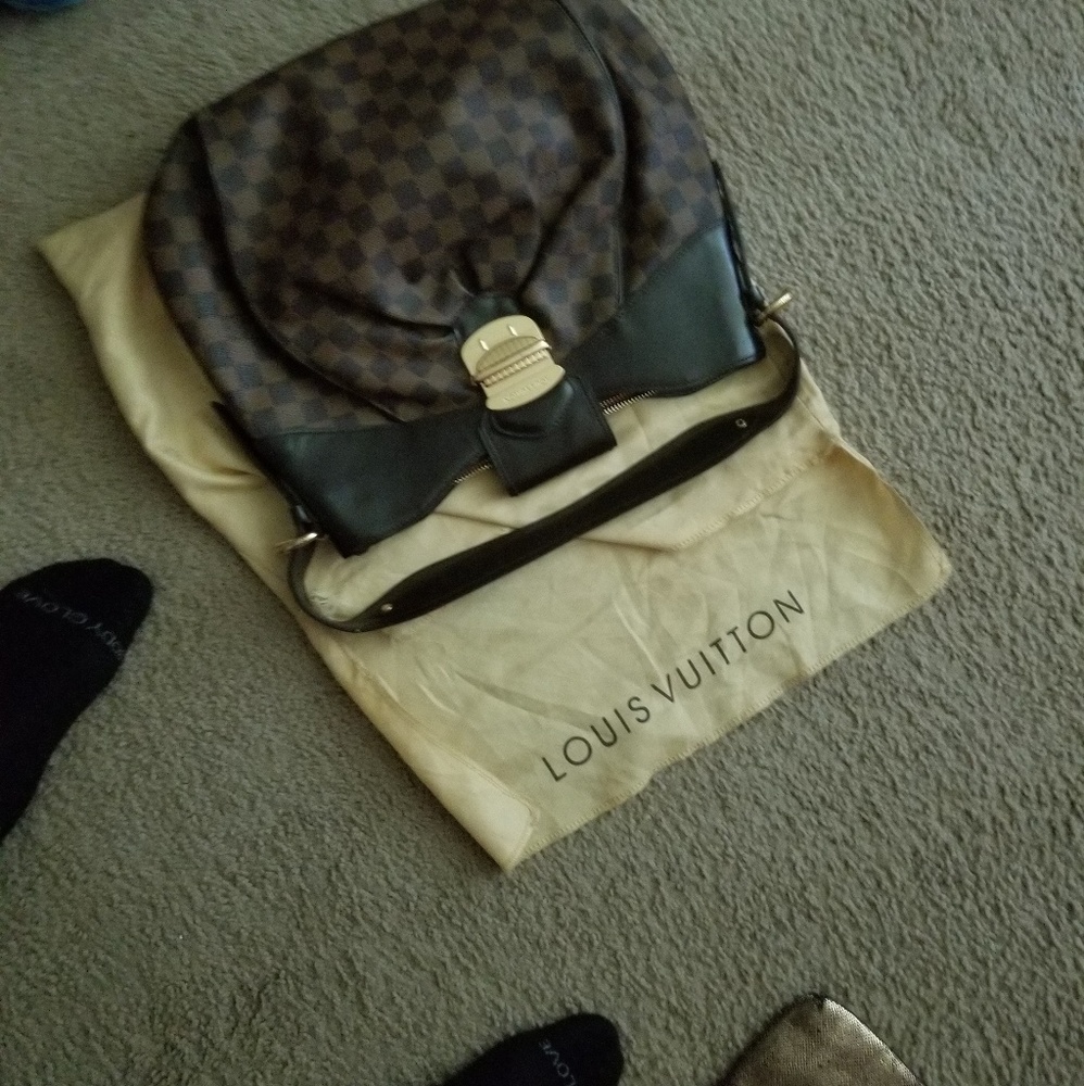 Authentic Louis Vuitton  shoulder bag with case.